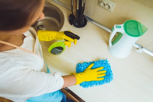 Management representative assessing a carpet cleaning complaint with documentation