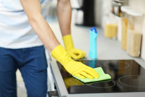 Technician and manager examining a cleaned carpet area during a complaint review